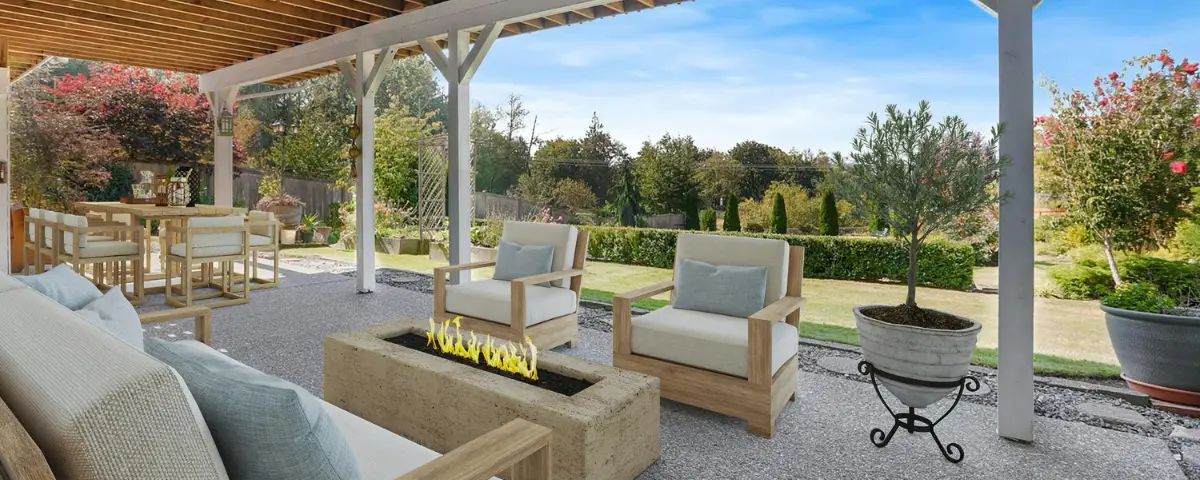 A large covered patio with lounge seating and a modern concrete fire pit in a spacious backyard, highlighting the outdoor entertaining potential of upsizing in Austin.