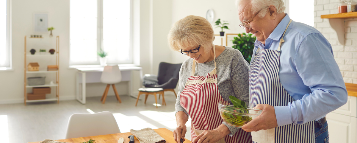 retired couple cooking together