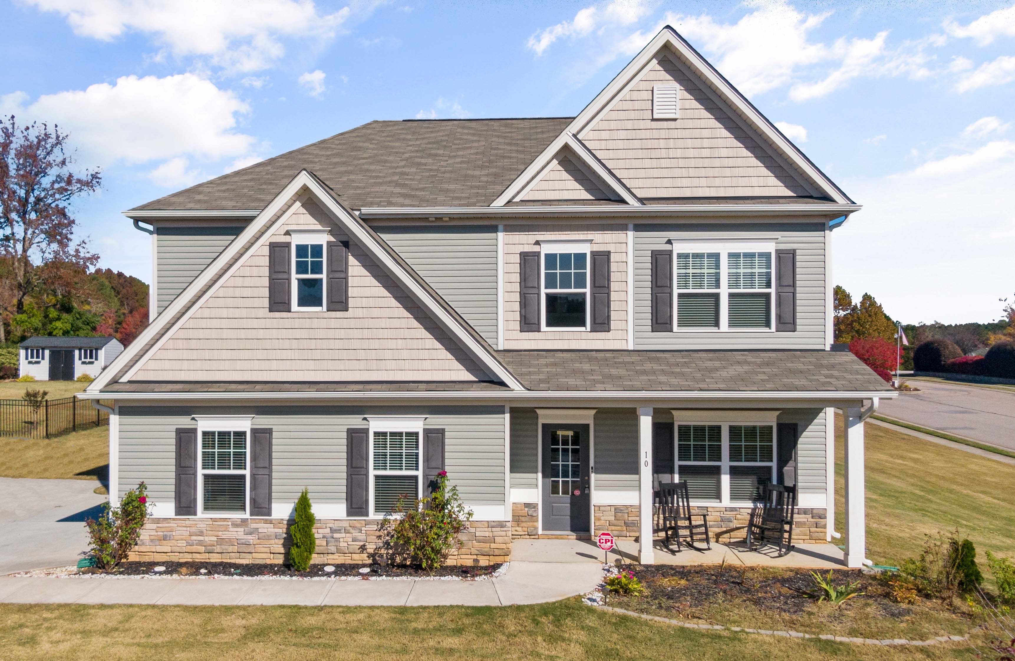 single family home with two floors and a front porch