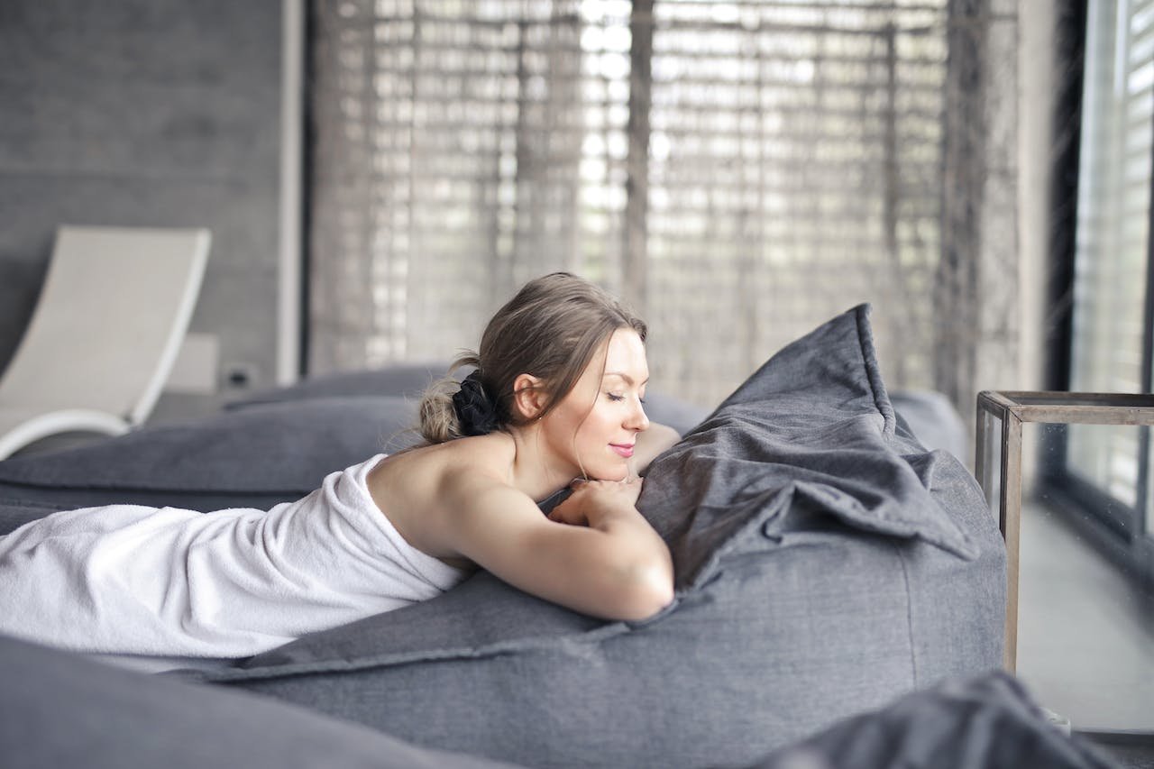 a woman laying on a spa bed