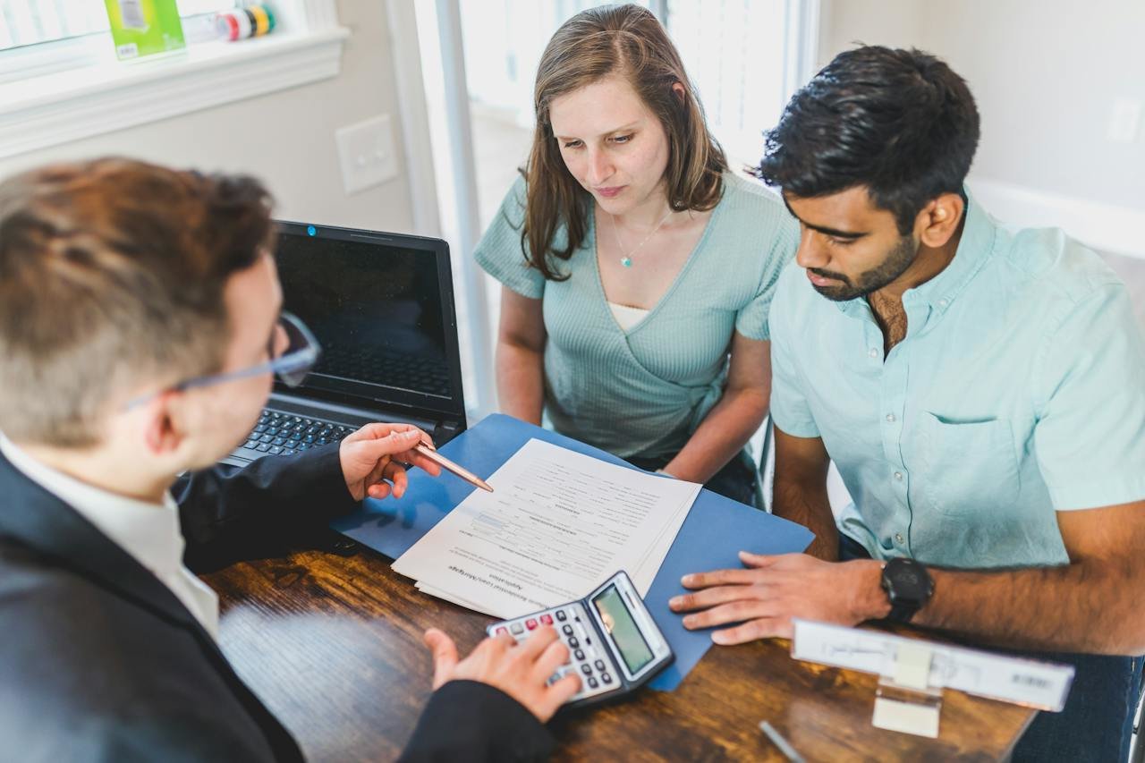a couple talking to a mortgage lender